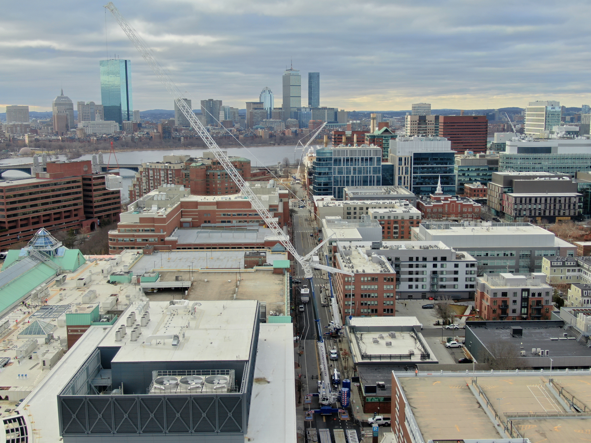 CJ Shaughnessy 770-ton crane with luffing jib working above Cambridge with the Boston skyline behind